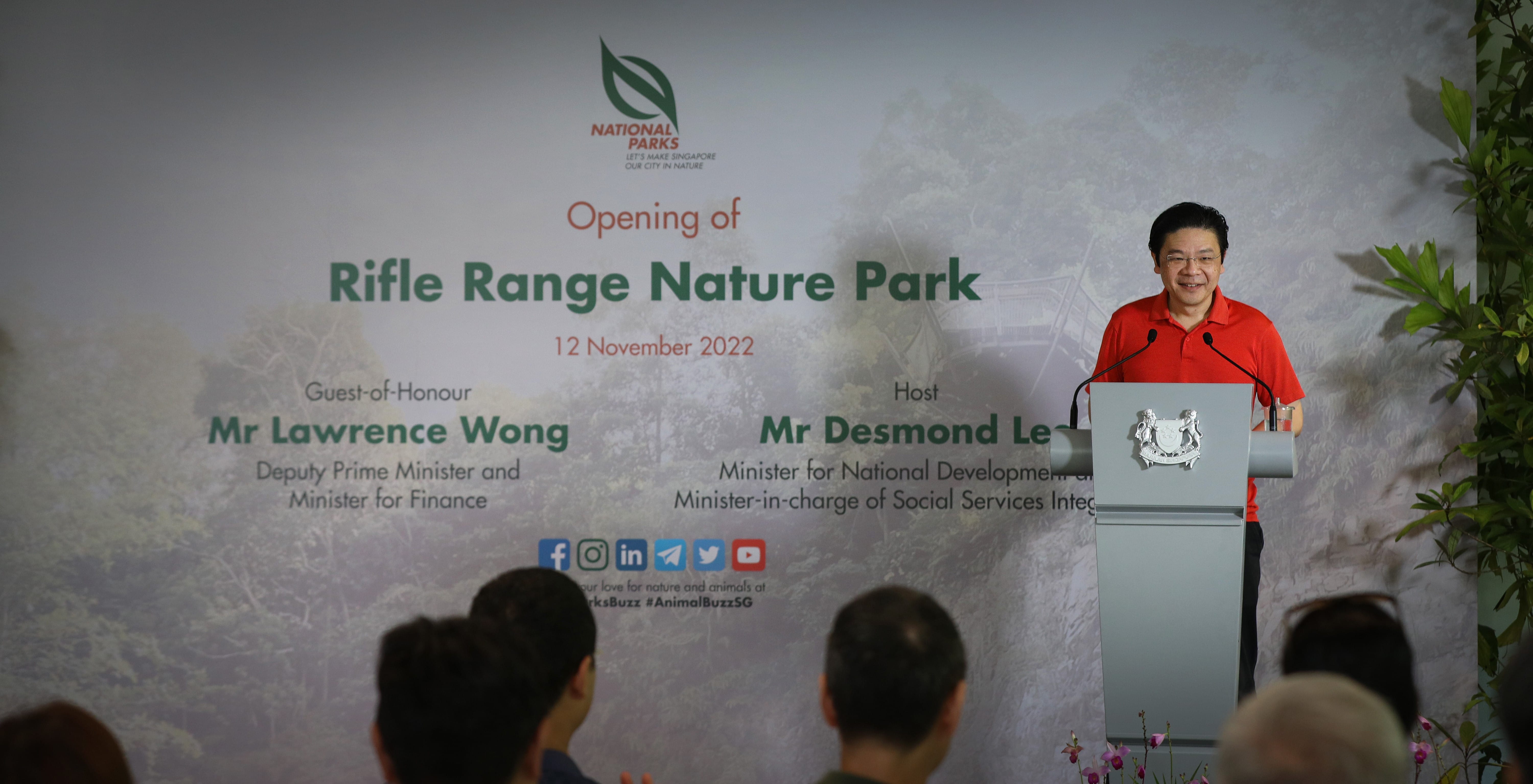 Lawrence Wong speaks at Rifle Range Nature Park opening, November 12, 2022. National Parks logo visible.